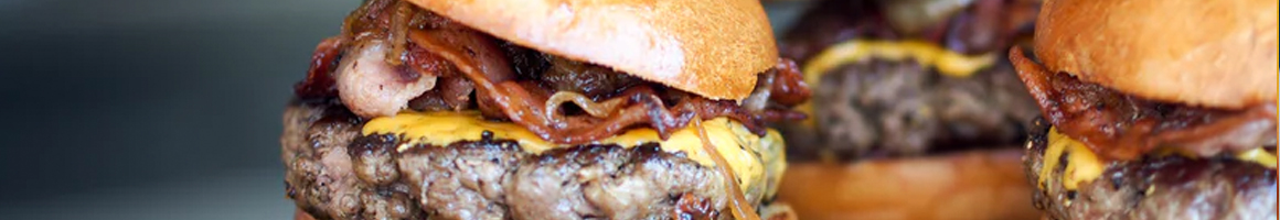 Eating American (Traditional) Burger at Mac & Ernie's Roadside Eatery restaurant in Tarpley, TX.